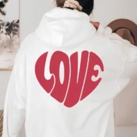 Жіноче біле худі з червоним принтом у формі серця та написом «Love» на спині. Женское белое худи с красным принтом в форме сердца и надписью «Love» на спине.